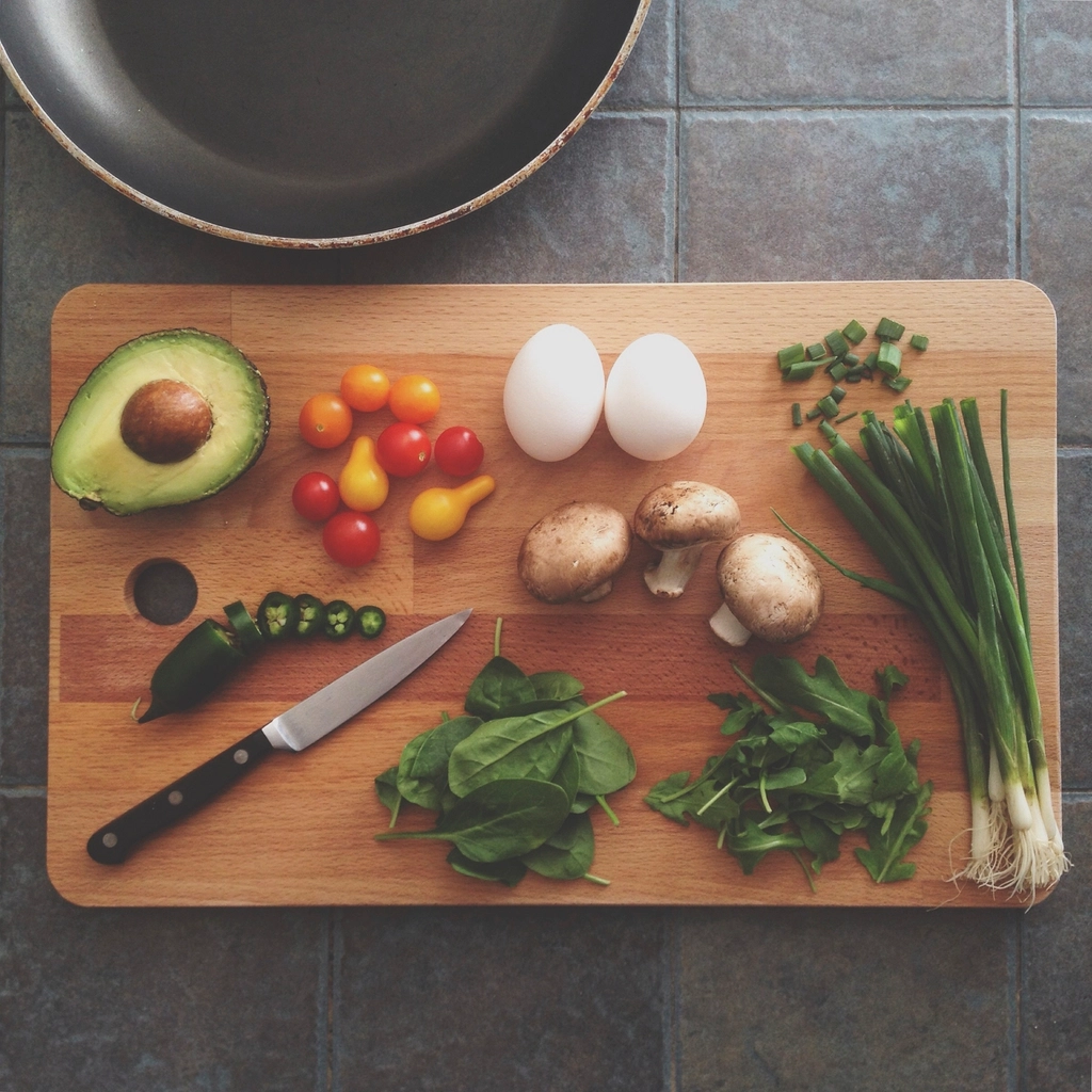 Prepped ingredients laid out around a knife